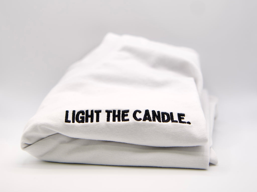 "Light The Candle." T-Shirt