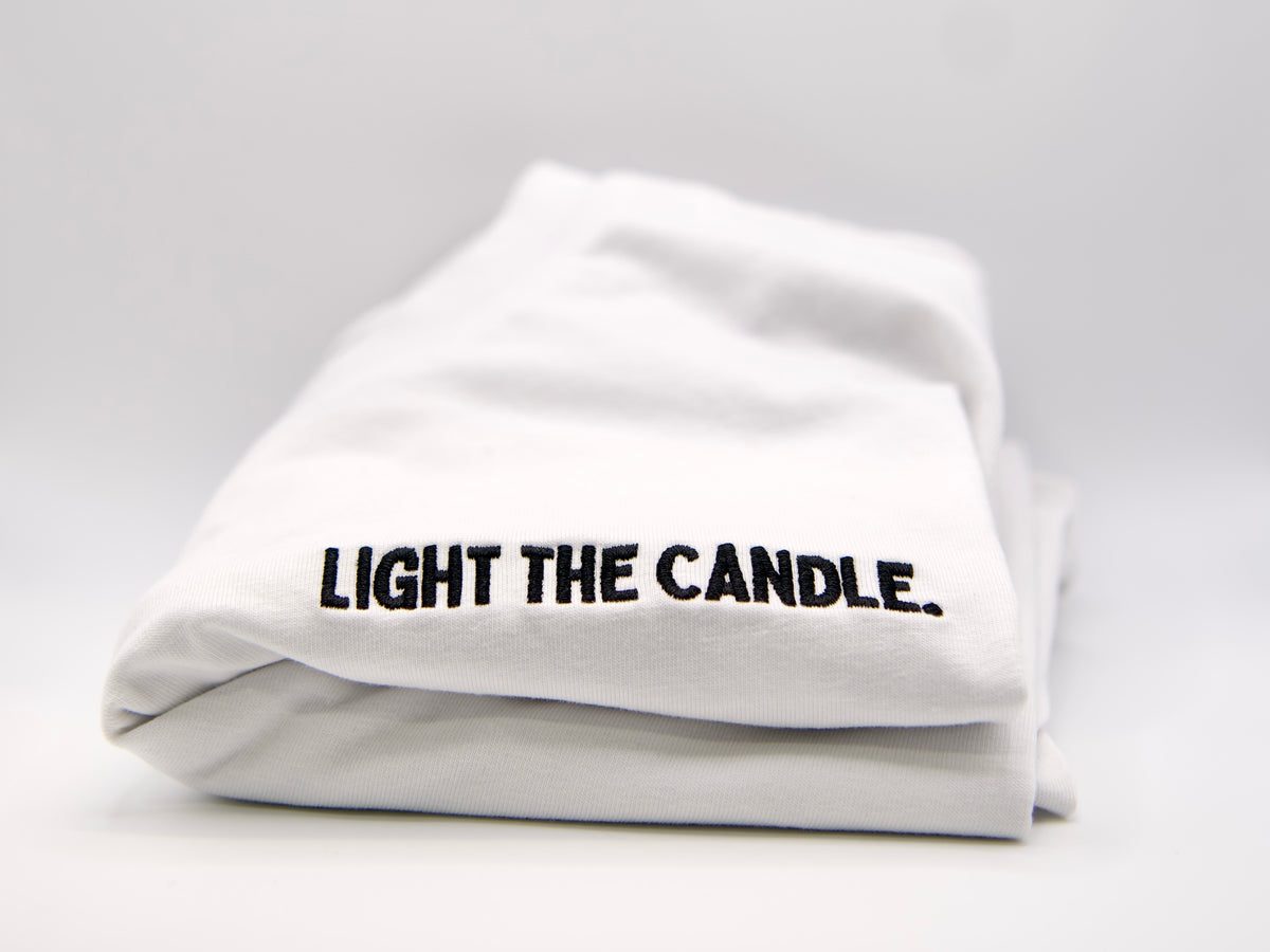 "Light The Candle." T-Shirt